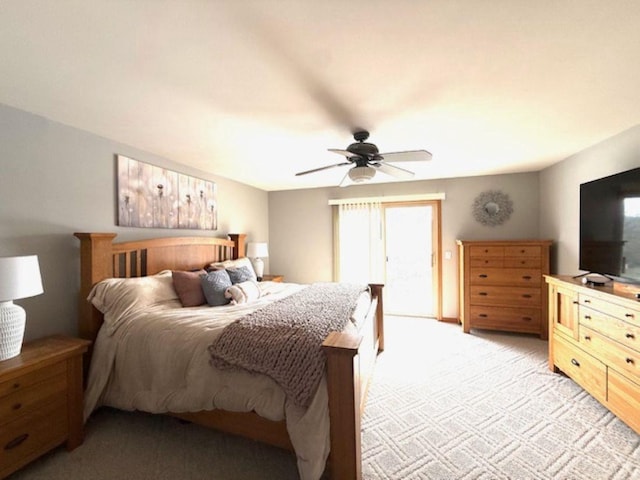 N4266 Cherokee Ct, Markesan, WI 53946 - bedroom featuring light carpet, access to exterior, and a ceiling fan