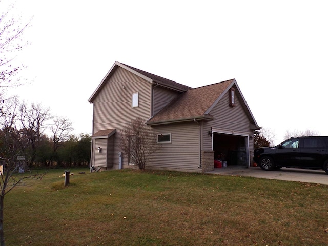 view of home's exterior featuring a garage and a lawn