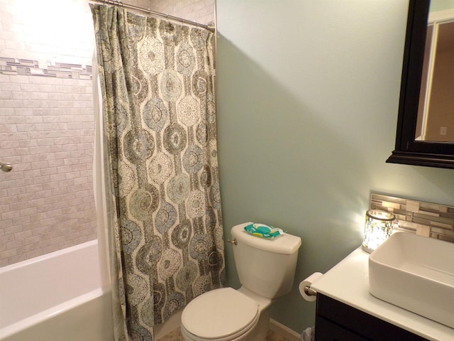 full bathroom featuring vanity, toilet, and shower / bath combination with curtain