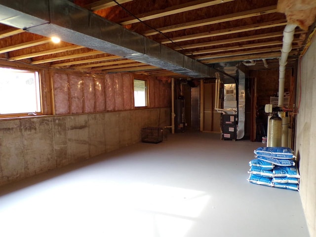 basement with gas water heater and heating unit