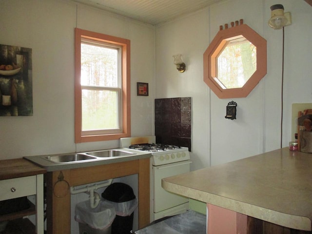 kitchen with white range with gas cooktop