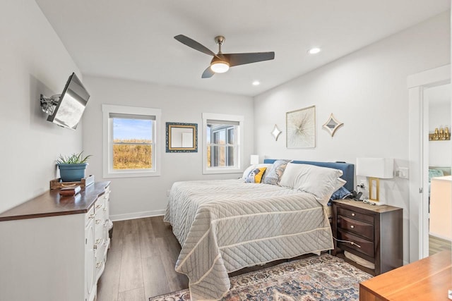 bedroom with dark wood-type flooring and ceiling fan