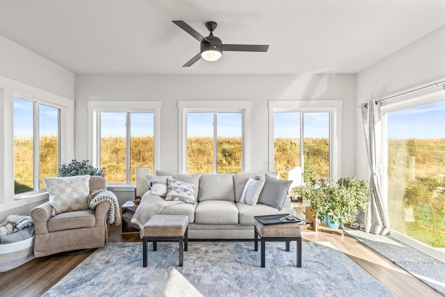 sunroom featuring ceiling fan