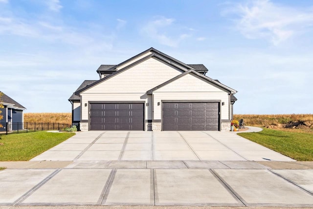 view of front facade featuring a front lawn and a garage