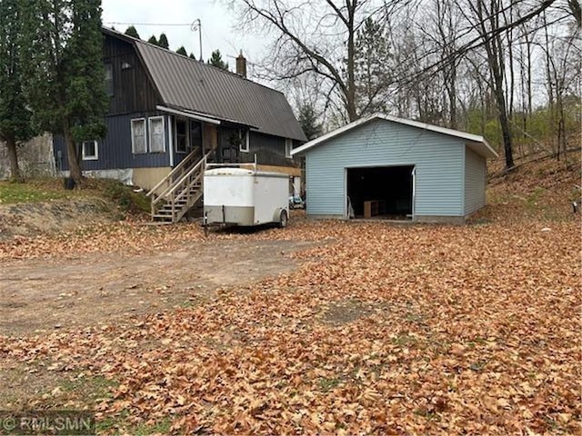 exterior space featuring an outdoor structure and a garage