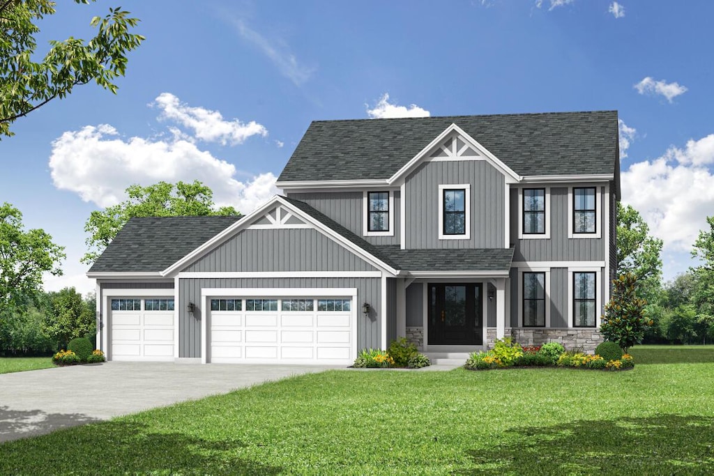 view of front of house with a front lawn and a garage