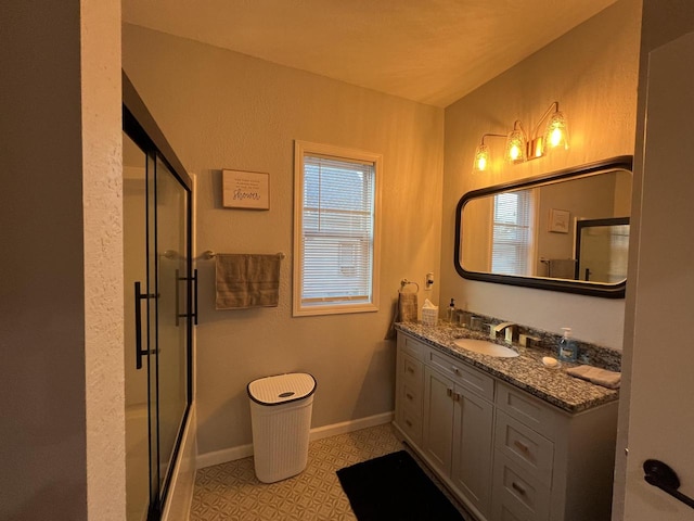 bathroom featuring shower / bath combination with glass door, vanity, and lofted ceiling