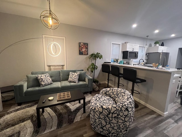 living room with dark hardwood / wood-style floors