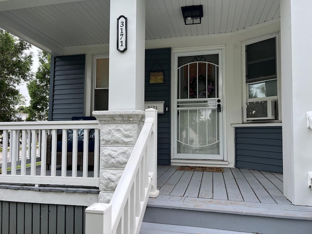 entrance to property featuring a porch