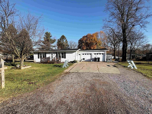 view of front of house with a front yard and a garage