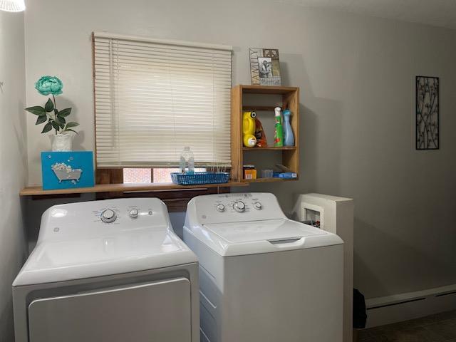 laundry area with washer and dryer and a baseboard radiator