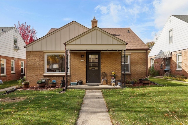 bungalow-style house featuring a front yard