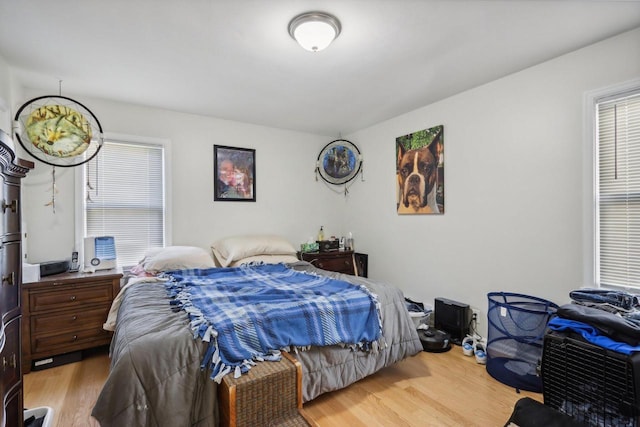 bedroom with light wood-type flooring