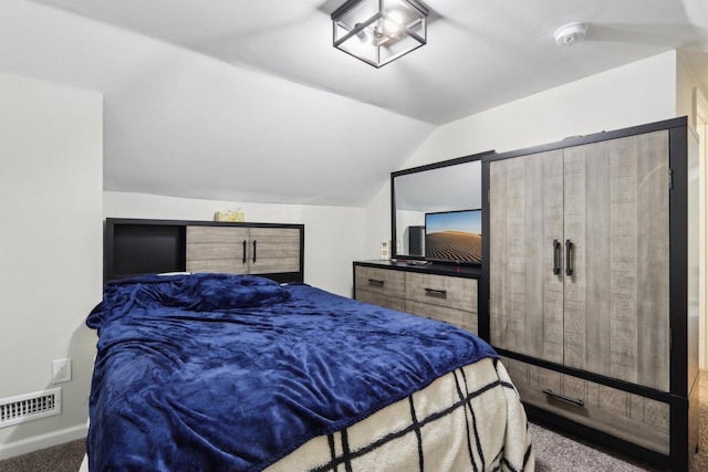 bedroom featuring carpet and vaulted ceiling