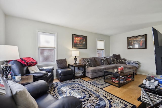 living room featuring a wealth of natural light and hardwood / wood-style floors