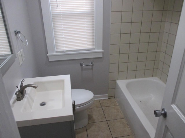 bathroom featuring toilet, vanity, and tile patterned floors