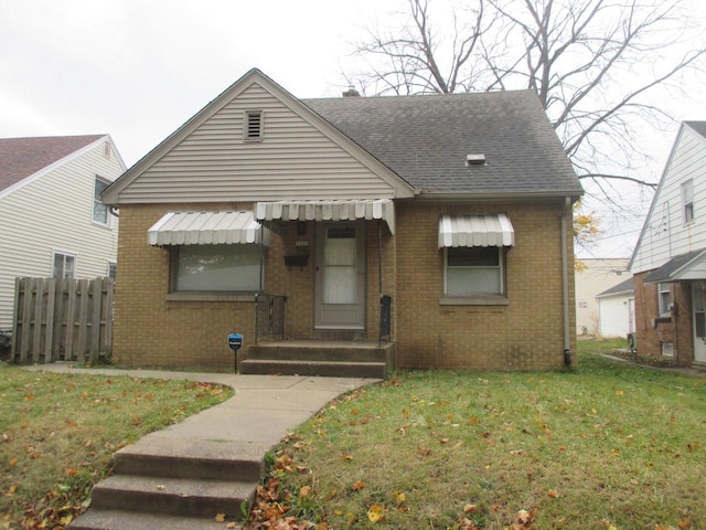 bungalow with a front lawn