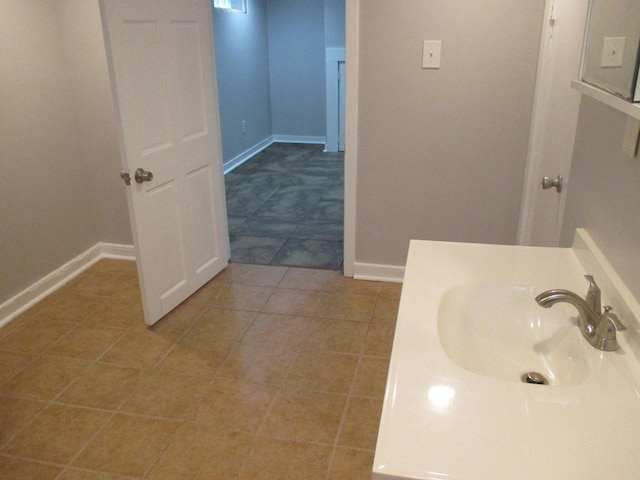 bathroom featuring sink and tile patterned flooring