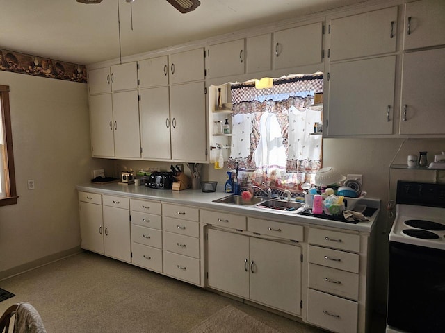 kitchen with sink, white cabinetry, ceiling fan, and white electric stove