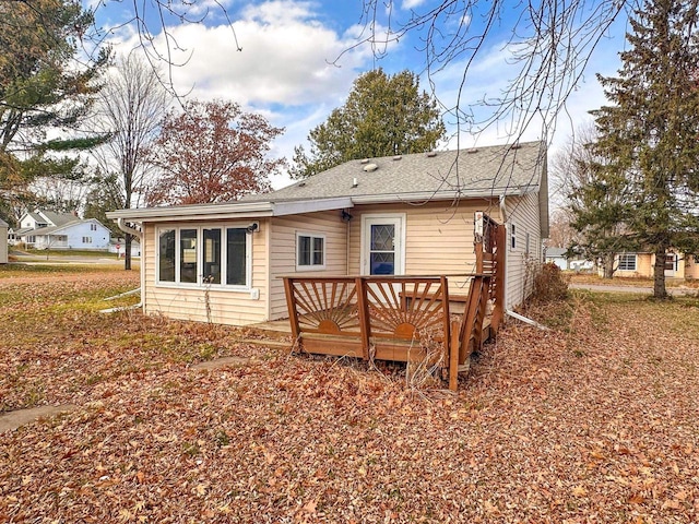 back of property featuring a deck