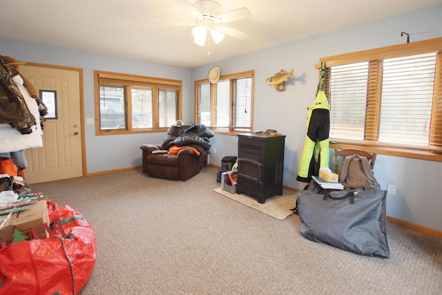 interior space with light colored carpet and ceiling fan