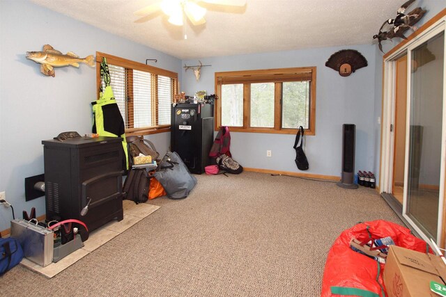 game room with light colored carpet and ceiling fan