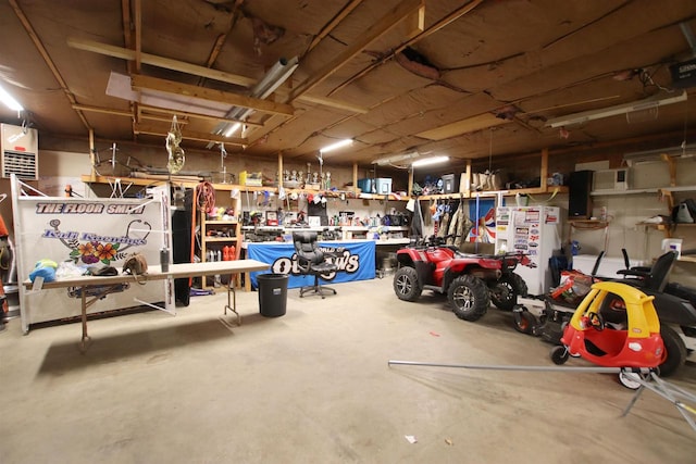 garage with a workshop area