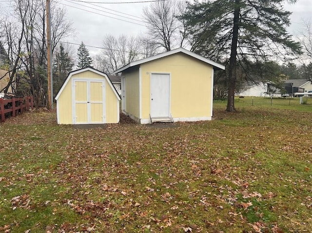 view of outbuilding with a lawn