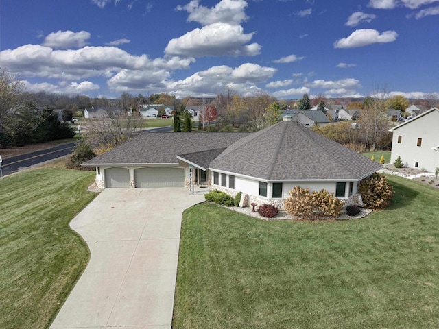 ranch-style home featuring a garage and a front lawn