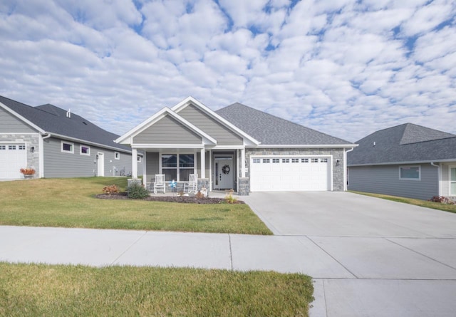 view of front of property featuring a garage and a front lawn