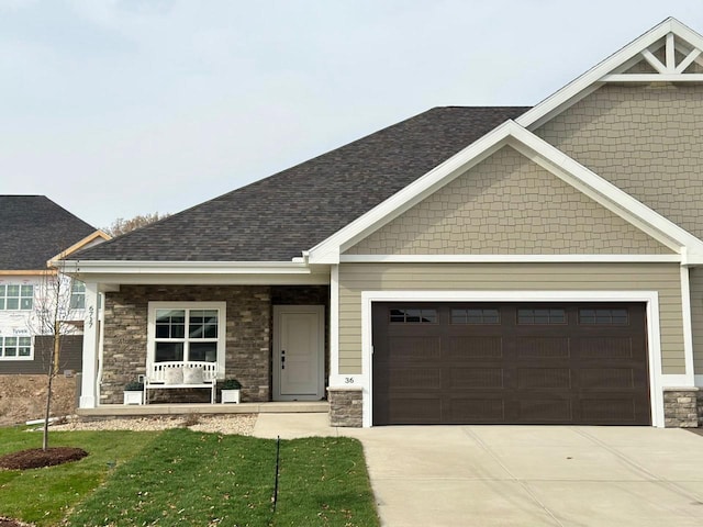 craftsman-style house with a garage and covered porch