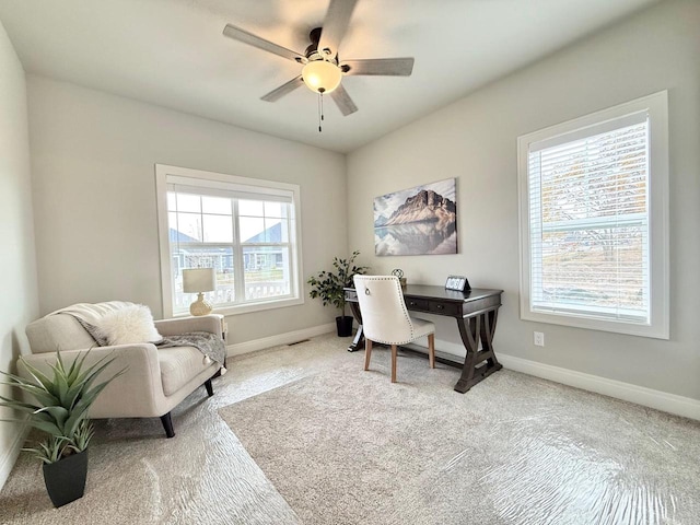 office area with ceiling fan, a healthy amount of sunlight, and carpet floors