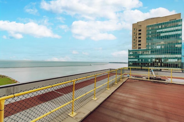 balcony featuring a water view