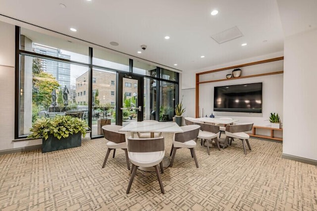 interior space featuring a wall of windows and light carpet