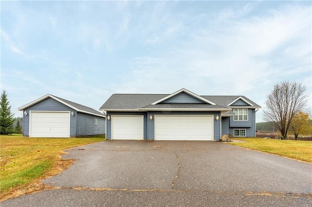 view of front facade with a front lawn and a garage