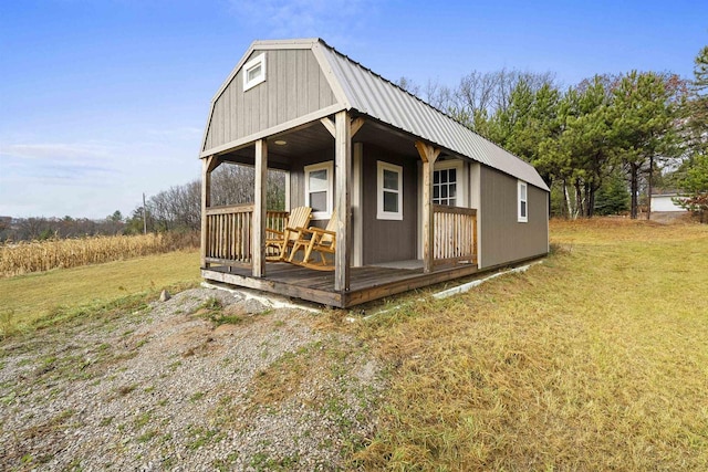 view of outbuilding featuring a lawn