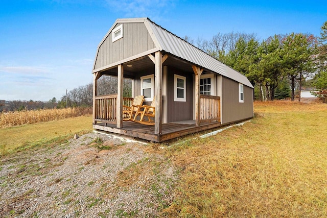 view of outbuilding with a lawn