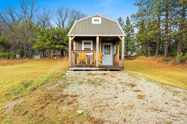 view of outdoor structure featuring a lawn