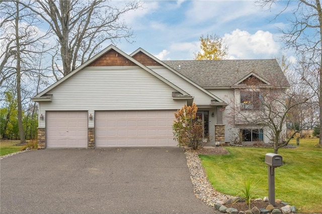 view of front facade with a garage and a front lawn