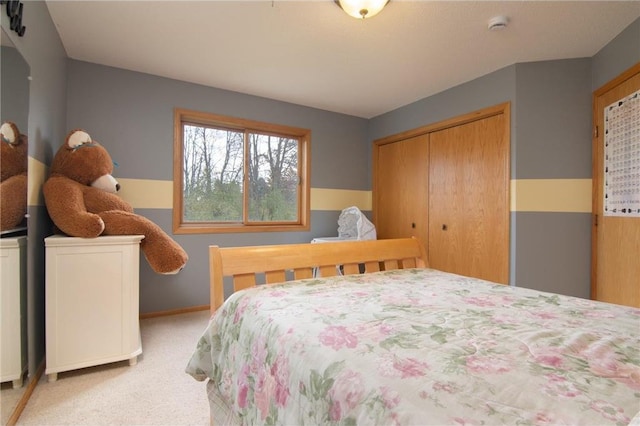 bedroom featuring light carpet and a closet