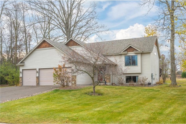 view of front facade with a garage and a front yard