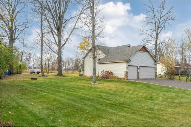 exterior space with a garage and a yard