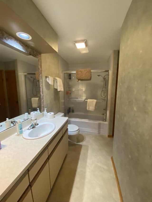 full bathroom featuring toilet, vanity, and shower / bath combination