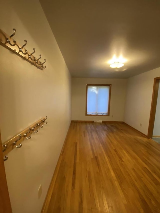 spare room featuring hardwood / wood-style floors