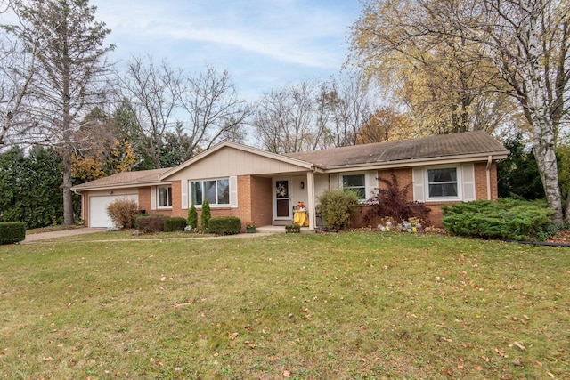 ranch-style house featuring a garage and a front yard