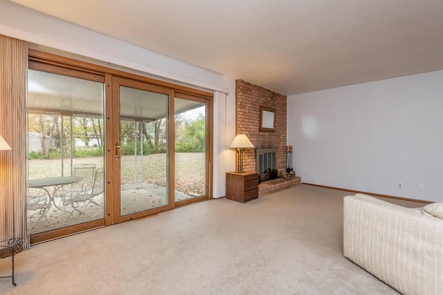 unfurnished living room with a wealth of natural light, light carpet, and a brick fireplace