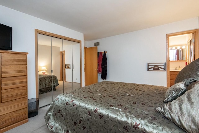 carpeted bedroom with a closet