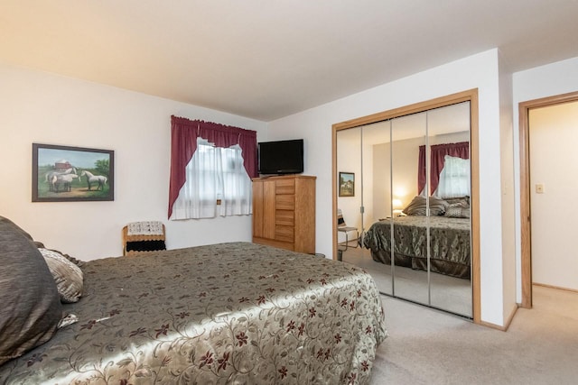 carpeted bedroom featuring a closet