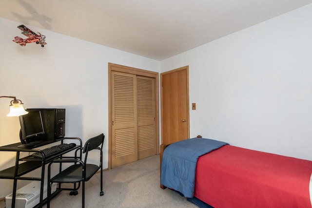 carpeted bedroom featuring a closet