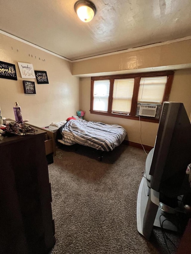 bedroom with cooling unit, carpet floors, and ornamental molding